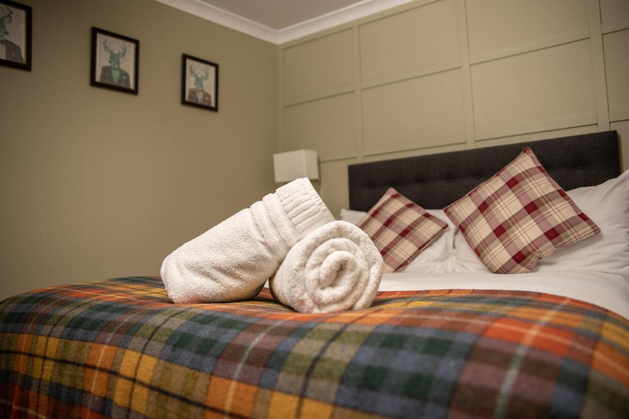 Отель The Oak House Axbridge Экстерьер фото A bed with a duvet